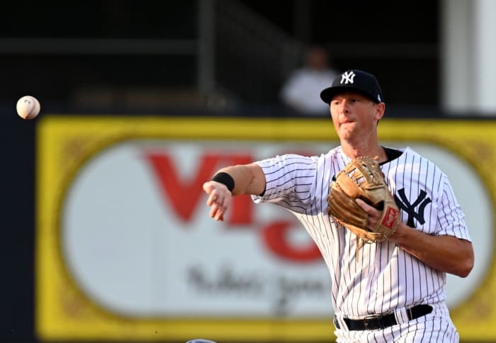 New York Yankees 2B DJ LeMahieu throws to first base